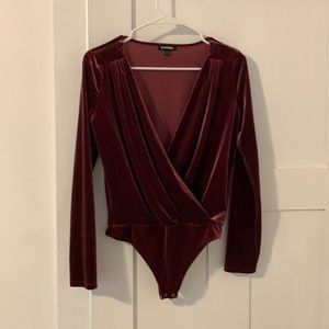 Express long sleeved bodysuit. Size small.